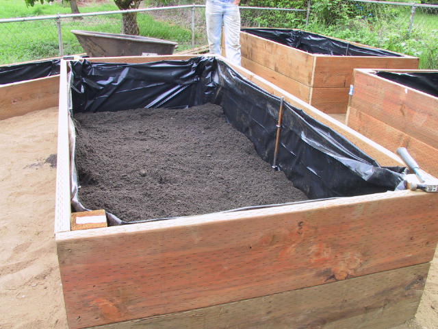 Half full of topsoil and compost